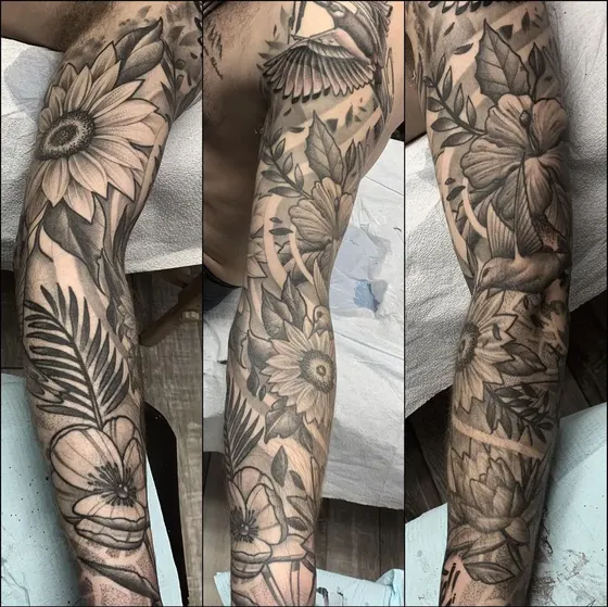 Black and grey floral full sleeve tattoo shown from three angles, tattooed at TBA Tattoos