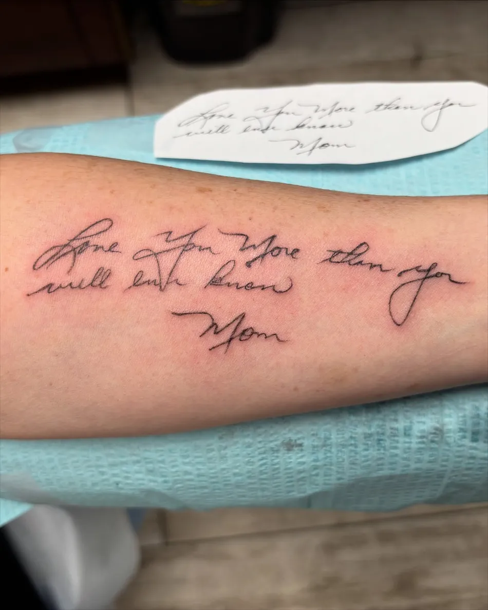 Handwritten memorial script lettering tattooed down a client's forearm at TBA Tattoos in West Palm Beach