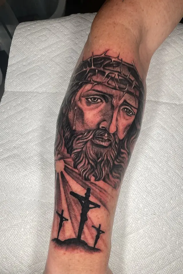 Black and grey realism portrait tattoo on a client's forearm, tattooed at TBA Tattoos in West Palm Beach